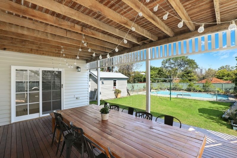 stylish patio with a roof and decorative lights hanging