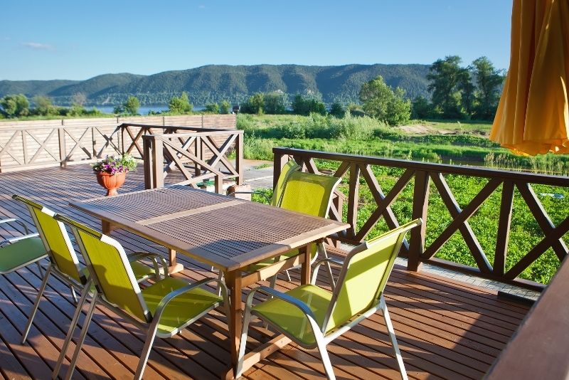 timber decking for a beautiful patio with a dining table and chairs