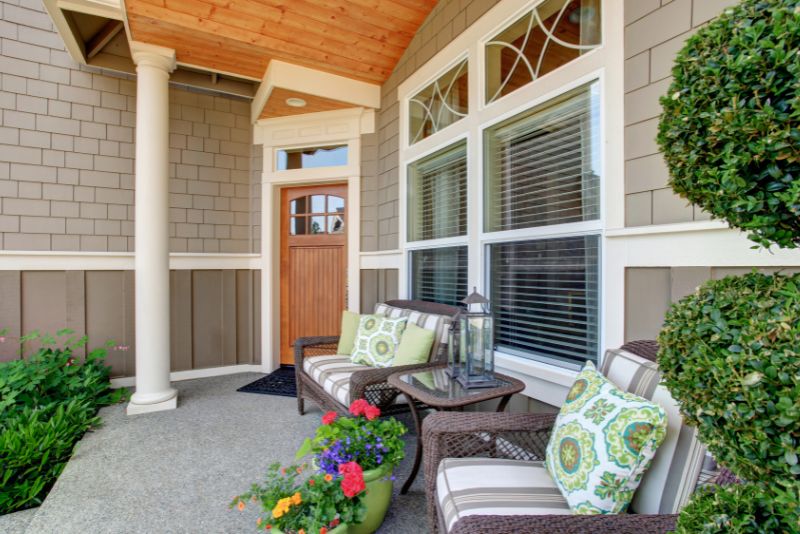 verandah with two outdoor chairs and atbale