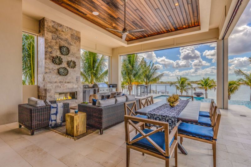 stylish outdoor living area with furniture and a fireplace
